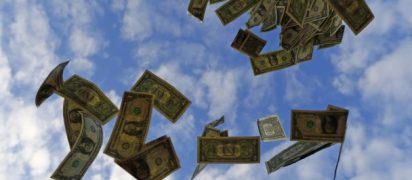 U.S. one dollar bills blow in this photo illustration near the Andalusian capital of Seville